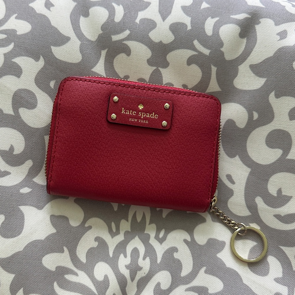 Kate Spade zip wallet with keychain. Red pebble leather. Elegant and practical.